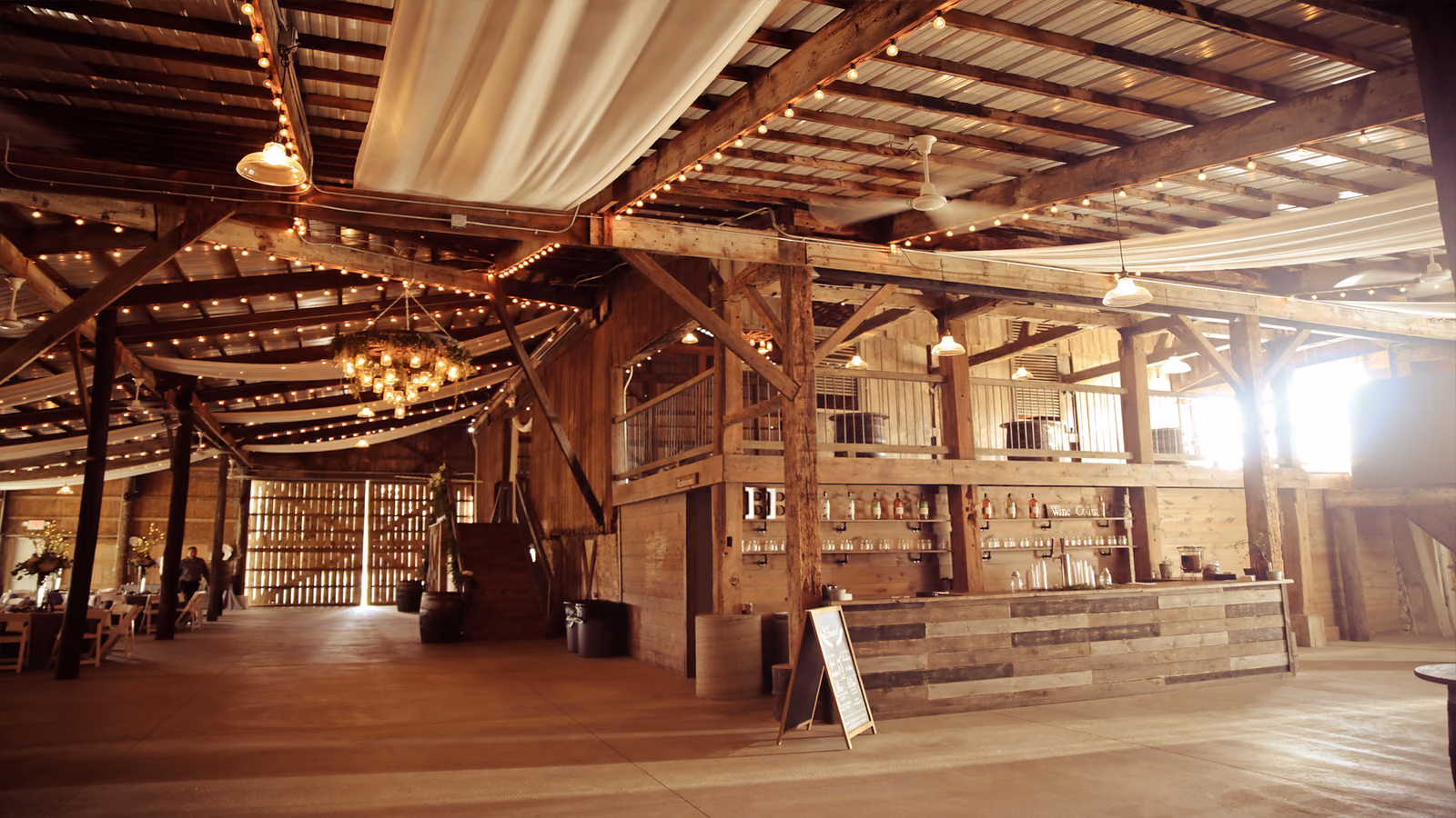 The warmly lit interior and bar at The Buckeye Barn