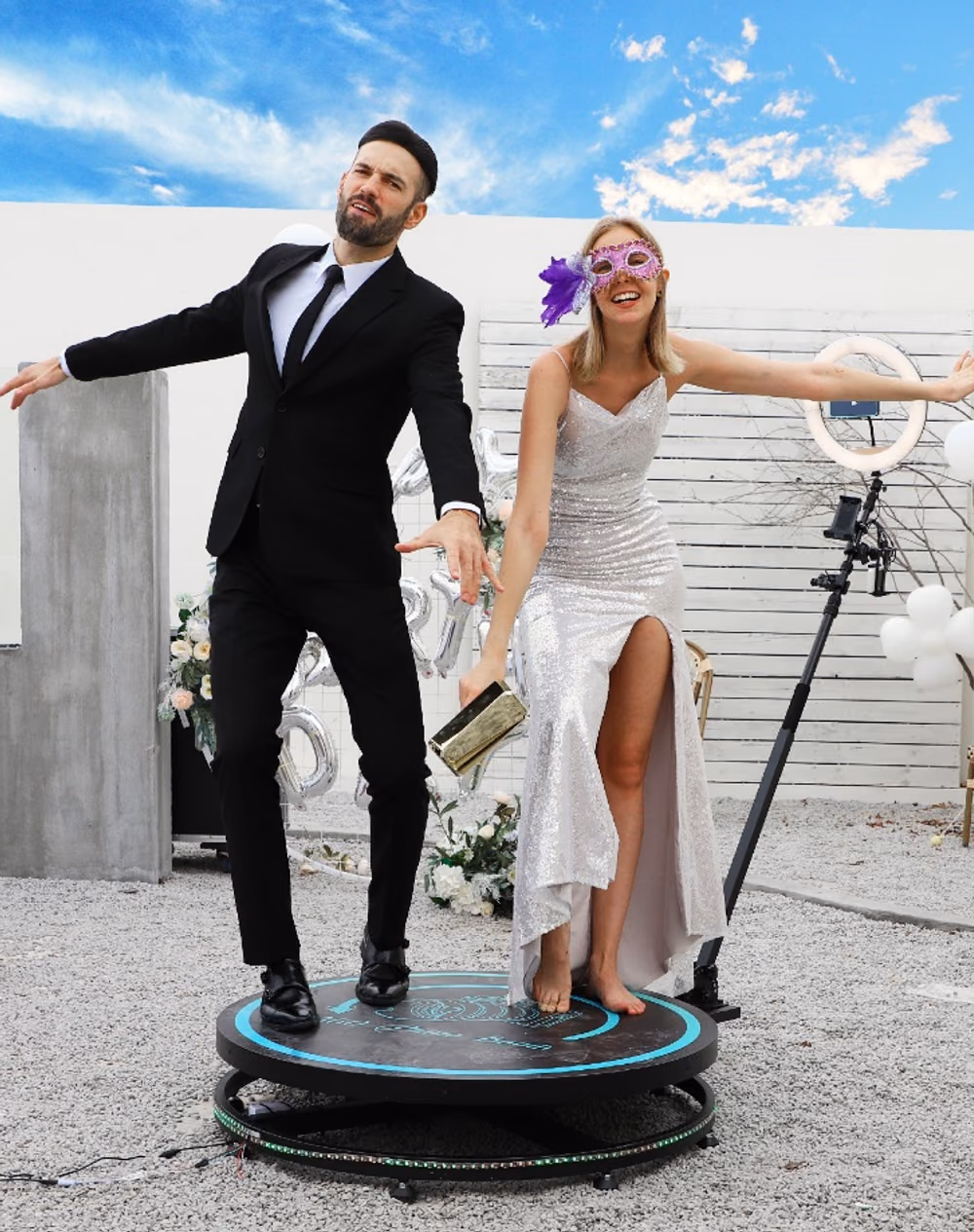 Guests posing on the 360 photo booth platform